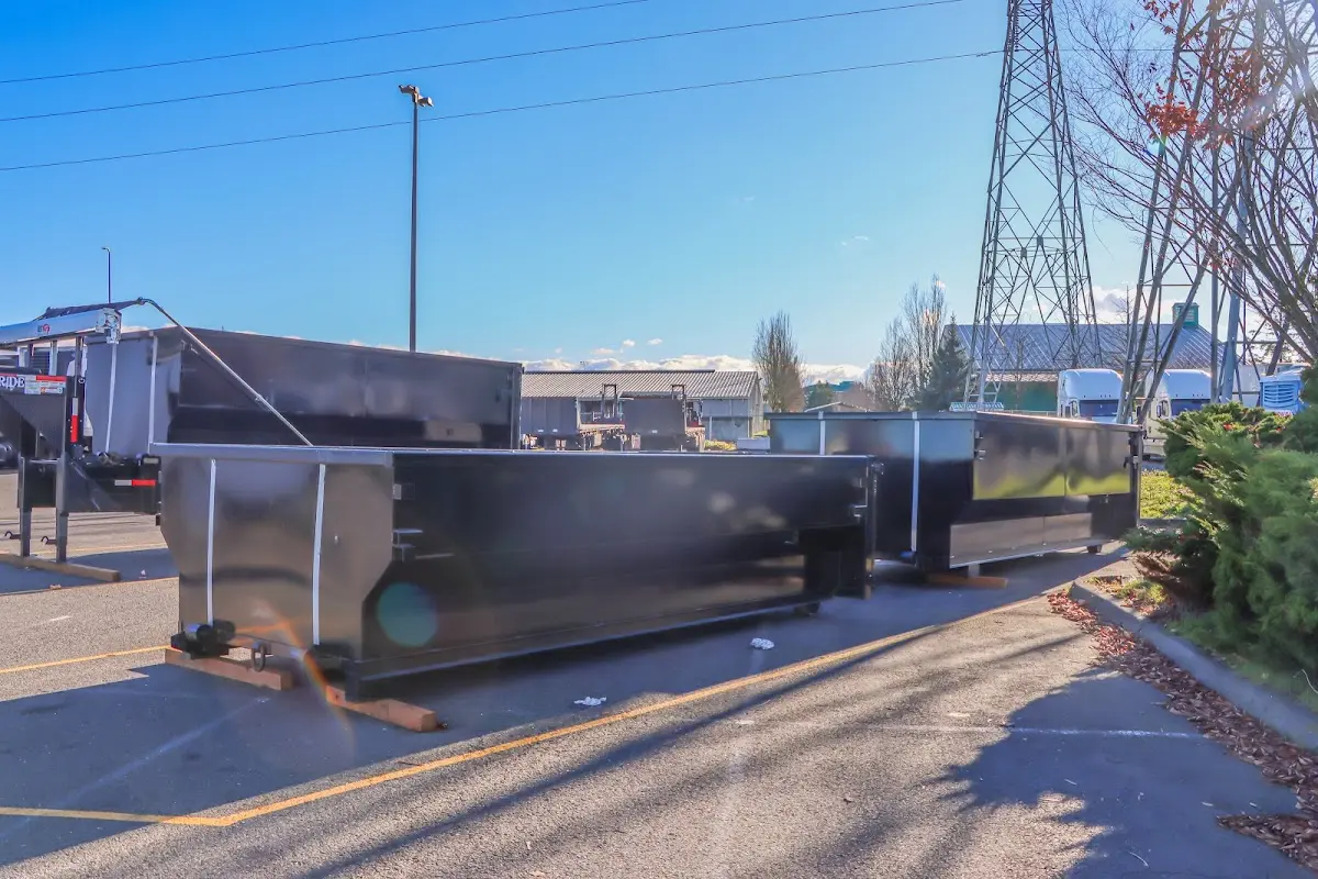 Roll-off dumpster ready for waste disposal at job site for Concrete Dumpster Rental in Live Oak